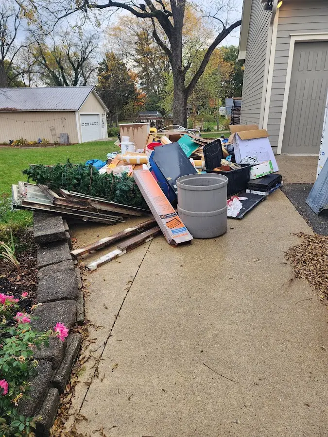 Dumpster being loaded with debris for Residential Dumpster Rental in Haines City